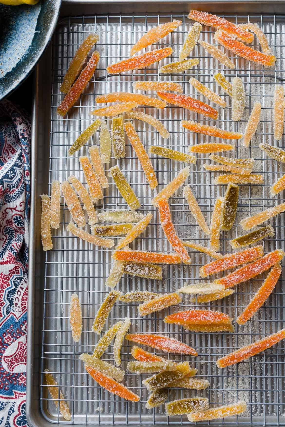 Drying candied citrus peel on rack.