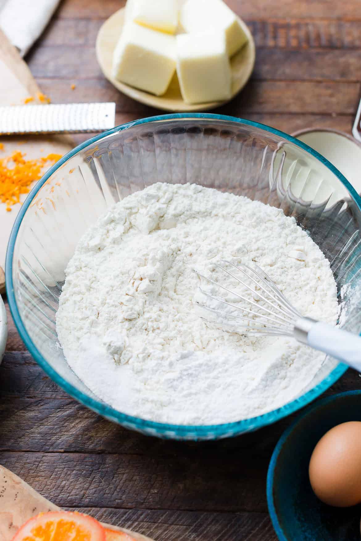 A bowl with flour and dry ingredients for Dark Chocolate Orange Cookies.