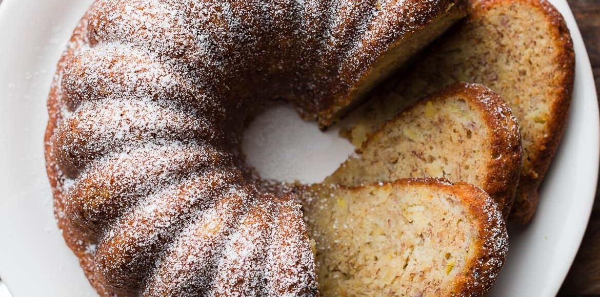Banana Pineapple Cake sliced on a serving plate.