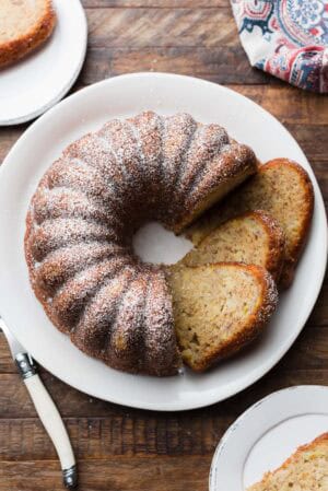 Banana Pineapple Cake sliced on a serving plate.