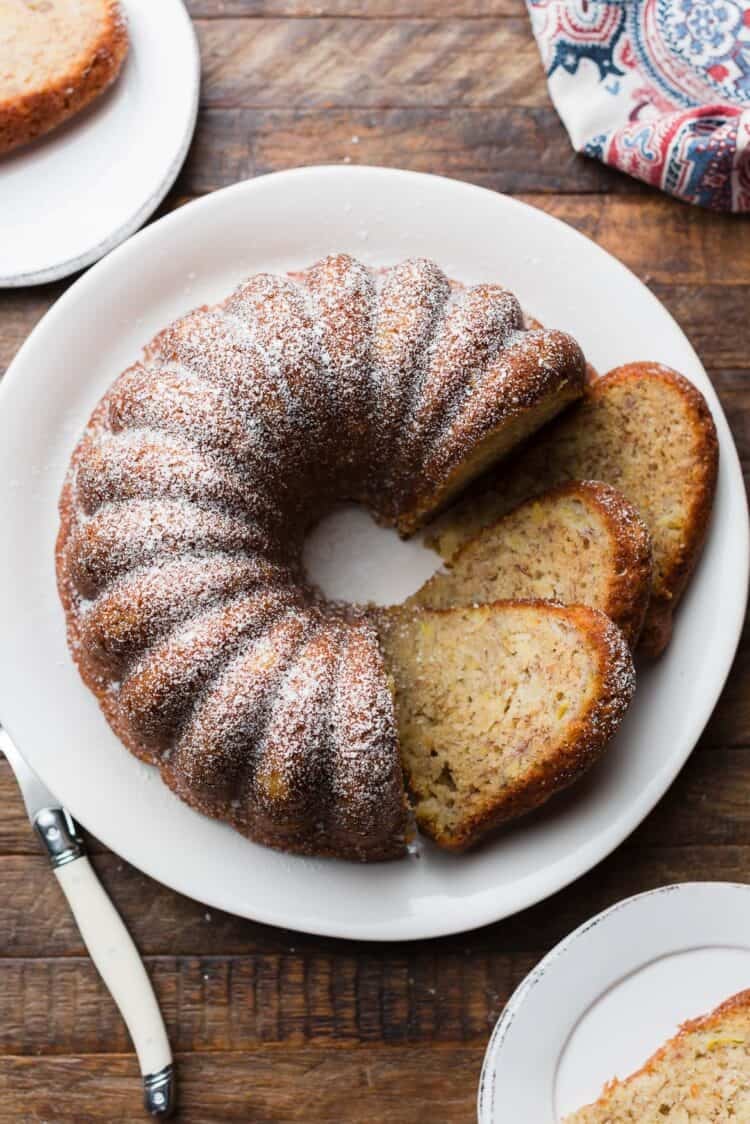 Banana Pineapple Cake sliced on a serving plate.