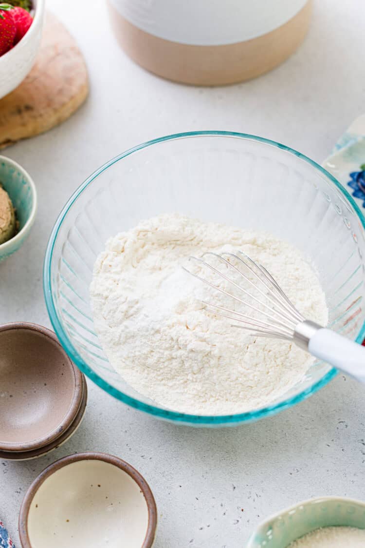 Whisking dry ingredients for strawberry shortcake cookies.