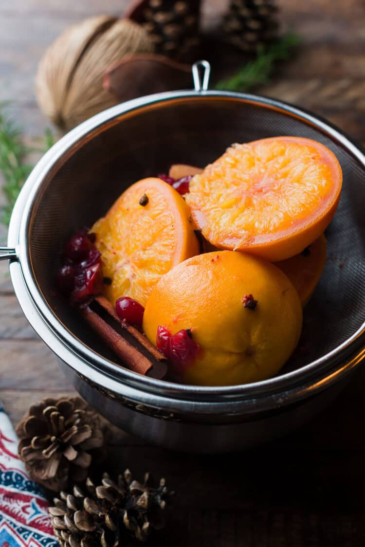 Straining fruits for wassail.