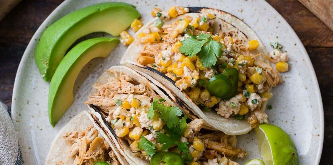 Mexican Street Corn Chicken tacos on a plate.