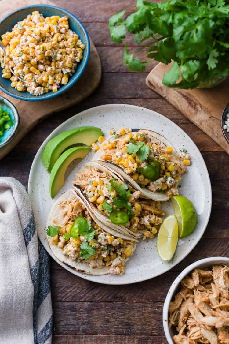Mexican Street Corn Chicken Tacos on a plate.