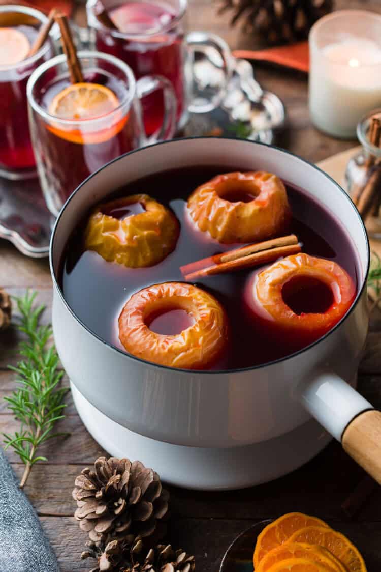 Wassail in a pot with spiced apples.