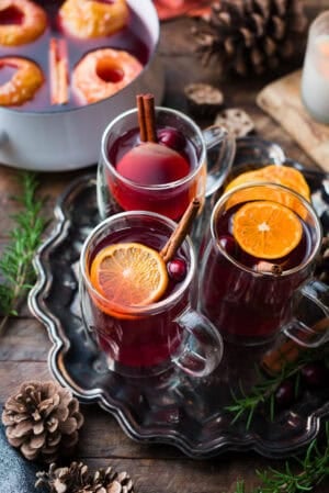 Traditional wassail garnished with oranges, cranberries, and cinnamon.