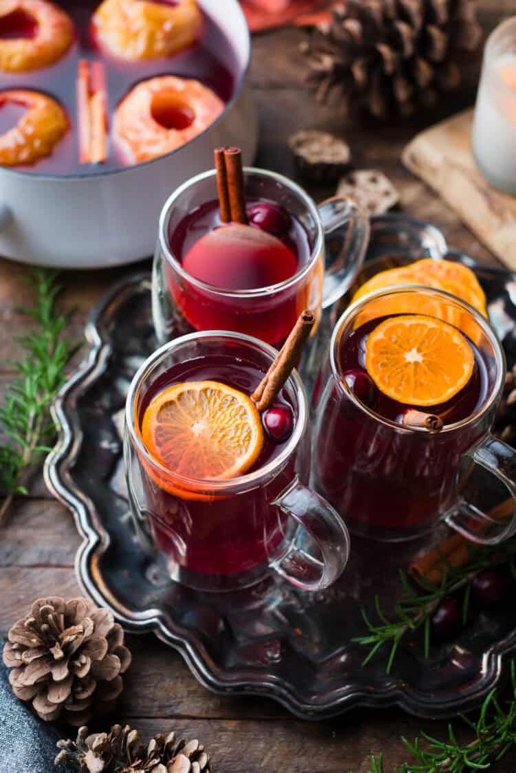 Traditional wassail garnished with oranges, cranberries, and cinnamon.