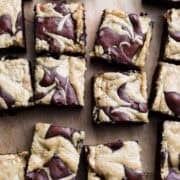 Mocha Brownies
with Olive Oil and Tahini Swirl sliced on a cutting board.