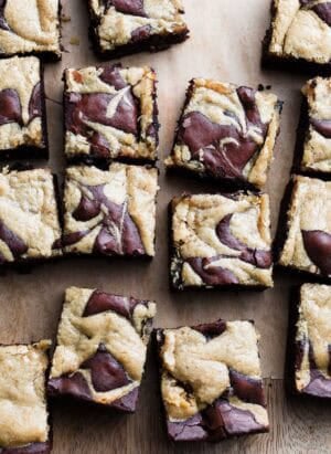 Mocha Brownies  with Olive Oil and Tahini Swirl sliced on a cutting board.