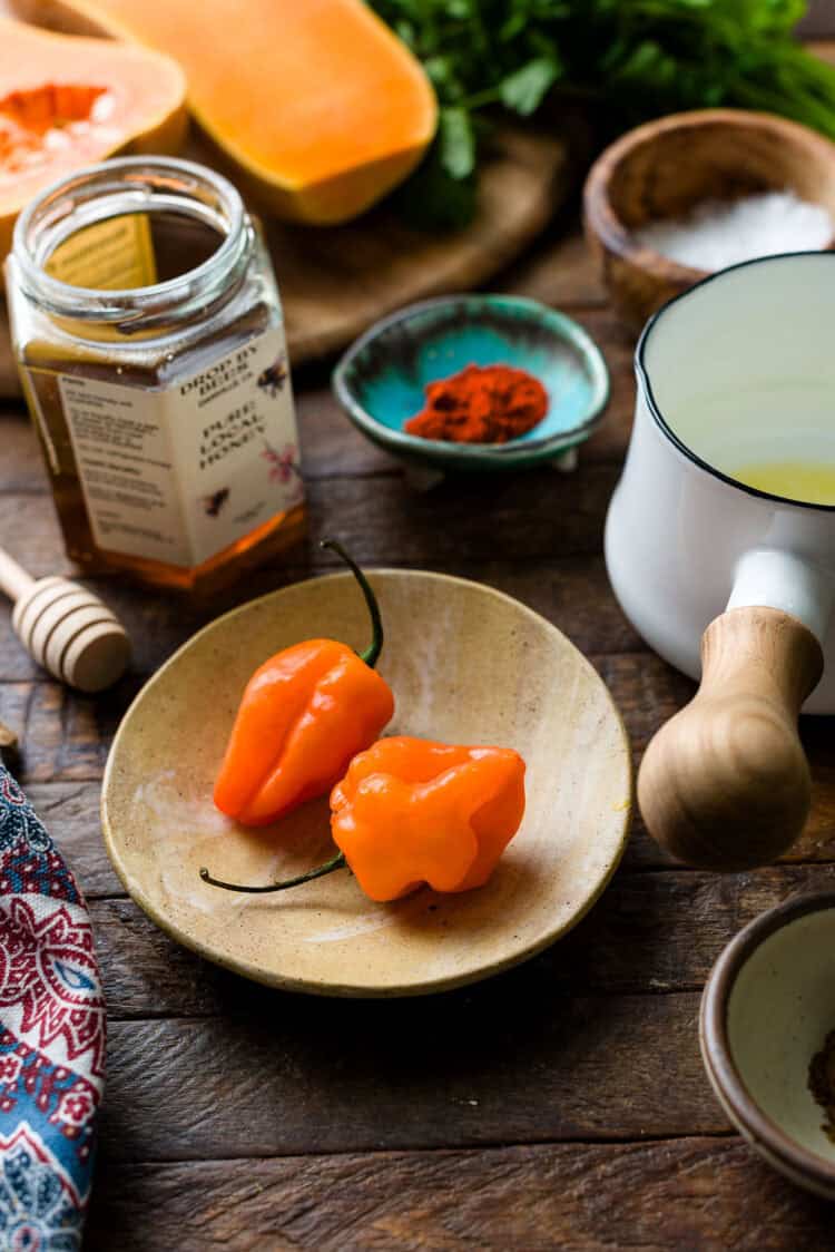Habanero peppers on a plate.