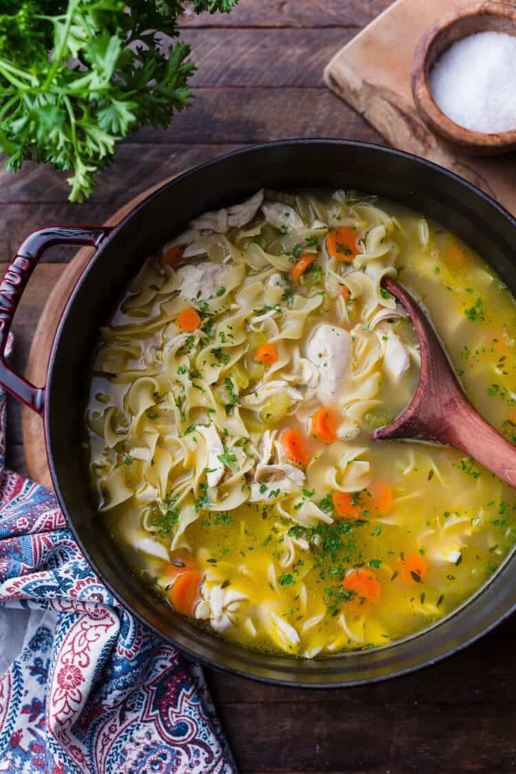 A pot/Dutch oven of chicken noodle soup.