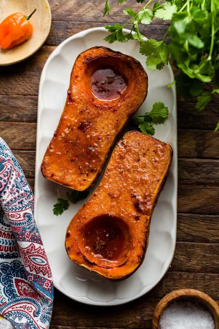 Roasted butternut squash with honey and habanero on a platter.