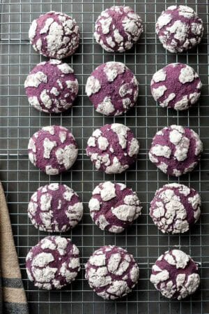 Ube Crinkle Cookes on a wire rack.