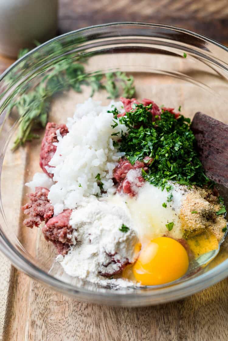 Ingredients for meatballs for albondigas in a glass bowl.