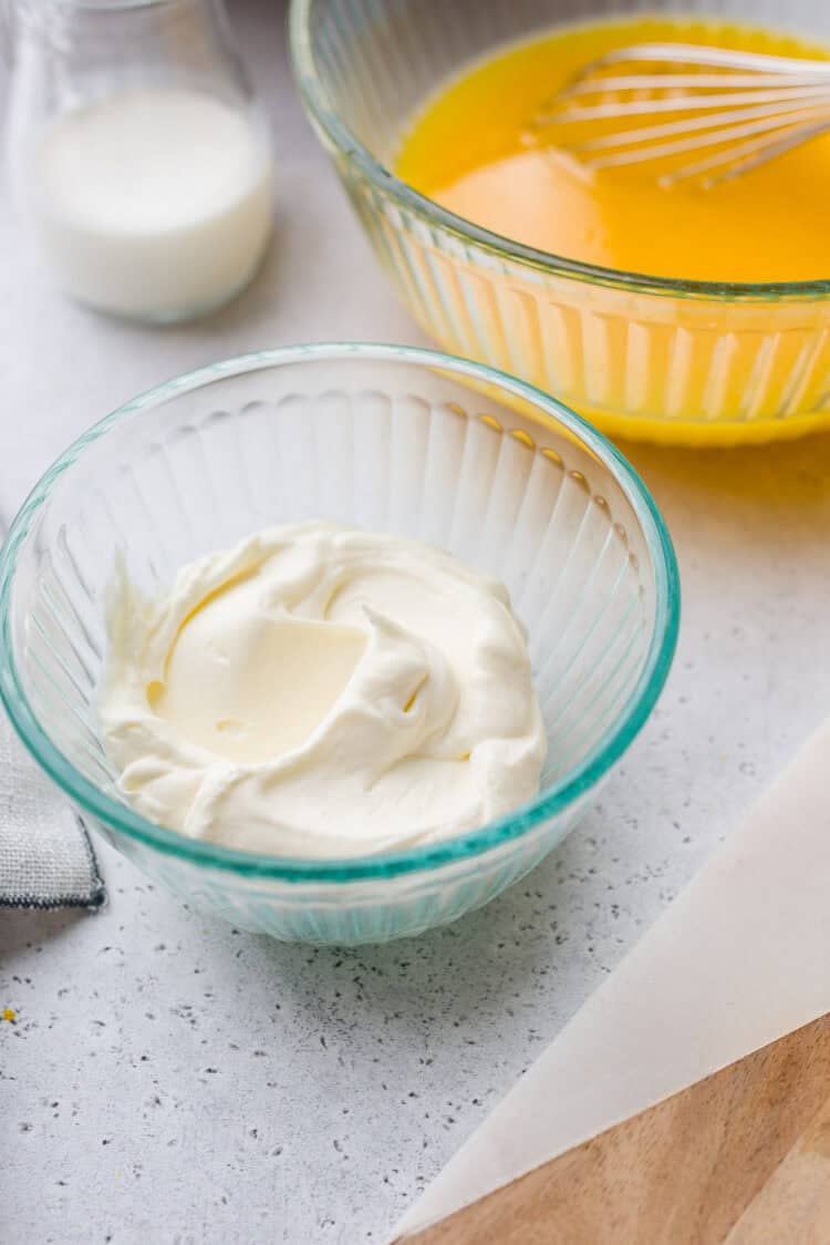 Whipped cream for an orange sherbet recipe.