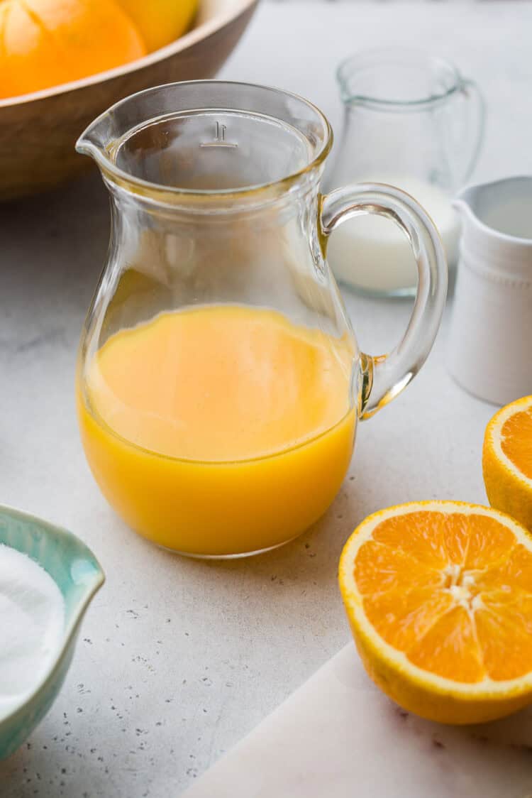 Freshly squeezed orange juice for an orange sherbet recipe.